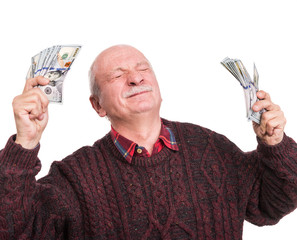 Senior man holding a stack of money. Portrait of an excited old businessman