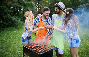 Friends having a barbecue party in nature