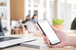 © mutarider15 - Woman hold smartphone - mock up woman used smartphone on the desk copyspace, business working and freelance, concept