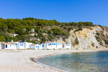 Wall Mural - Small white fishermen houses in Barraca Portitxol beach, in Javea, Spain