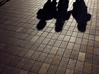 Canvas Print - People shadow on the pavement floor