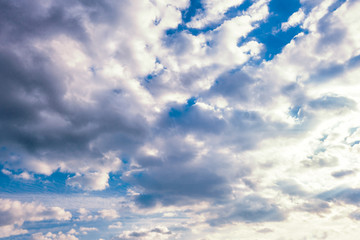 light fluffy clouds on a bright blue sky