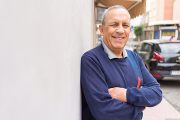 Wall Mural - handsome middle age senior man smiling cheerful, happy and positive leaning over white background wi