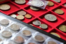 Numismatic, World Coins Collection On A Red Tray.