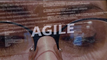 Agile text on the background of female software developer. Eyes of woman with glasses are looking at programming network code space abstract technologies connecting global data network