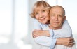 © BillionPhotos.com - Portrait of happy senior couple smiling at home