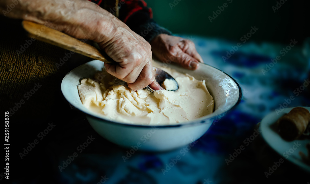 Wip Spoon Photo Stock hands of an old woman with a wooden spoon, whip homemade ...