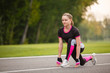 © Olga Mishyna - sport girl making exercises outdoors. Young sport woman in a park. Sport and fitness on open air