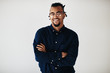 © Flamingo Images - Confident young African American entrepreneur standing against a