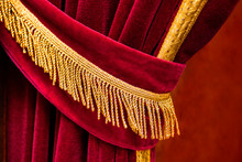 Close Up Detail Of Open And Ruffeld Red Curtain With Golden Fringes Tassel With Blurred Background - Concept Theater Stage Elegance Show Entertainment Event Textile Material Luxury Open Left Side