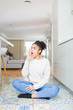 © Krakenimages.com - Beautiful young african american woman with afro hair sitting on the floor shouting and screaming loud to side with hand on mouth. Communication concept.