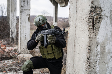 Anti terrorist SWAT special police in action aiming automatic rifle on the rescue mission