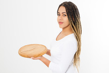Young Attractive African American Woman Holding Empty Wood Pizza Cutting Board Isolated On White Background. Copy Space And Mock Up. Blank Template Background. Top View