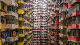 Fototapeta  - Aerial view of Yick Fat Building, Quarry Bay, Hong Kong. Residential area in old apartment with windows. High-rise building, skyscraper with windows of architecture in urban city.