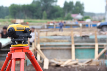 Surveyor's Work Tool Against The Background Of The Construction Site. Measuring Tool Of The Geodetic Service.