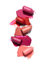 Creative Concept Photo Of Cosmetics Swatches Beauty Products Lipstick On White Background.