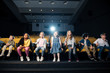 © LIGHTFIELD STUDIOS - group of multicultural friends sitting in first row in cinema