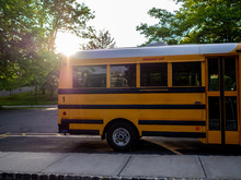 Yellow School Bus At Sunset