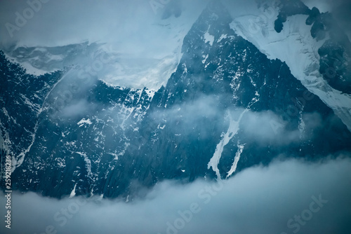 Low Cloud Before Huge Glacier Giant Snowy Rocky Mountain Wall In Thick Fog Early Morning In Mountains Impenetrable Fog Dark Atmospheric Foggy Landscape With Cold Rocks Tranquil Mystic Atmosphere Foto De Stock Low Cloud Before Huge Glacier Giant Snowy Rocky Mountain Wall In Thick Fog Early Morning In Mountains Impenetrable Fog Dark Atmospheric Foggy Landscape With Cold Rocks Tranquil Mystic Atmosphere Foto De Stock