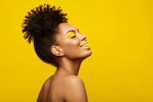 Excitement African American Fashion Model Profile Portrait . Satisfied Brunette Young Woman With Afro Hair Style,creative Yellow Make Up, Lips And Eyeshadows On Colorful Background