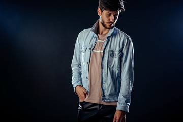 Handsome well-dressed man posing in studio