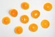 Orange slices on white rustic wooden background, top view, flat lay