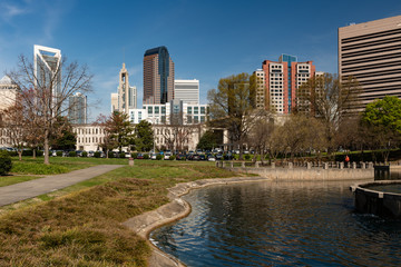 Wall Mural - Charlotte, North Carolina skyline cityscape on a spring day with copy space