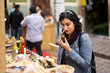 © Per Swantesson/Stocksy - Customer smelling delicious products at a farmers market