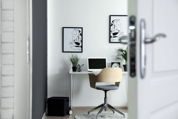 Poster - Stylish home office interior, view through open door