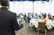 © Jetta Productions/Stocksy - Convention Center Business Lunch Meeting