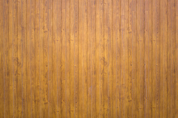 yellow gray wooden plank fence. vertical lines. rough surface texture