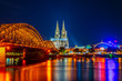 Night view of the cathedral in Cologne and Hohenzollern bridge over Rhein, Germany