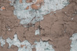 Old wall with cracks and plaster. Concrete wall brown ruined wall. Grunge texture. Cracks in the stucco on wall background. Retro abstract closeup of brown ruined wall. Dirty brown and blue shabby wal