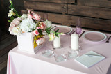 Fototapeta  - Setting the wedding table for a young couple