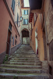 Fototapeta Uliczki - Italian narrow streets with stairs, Lake Como. Alps, Italy, Lombardi, Europe.