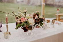 Burgundy, Pink And White Flowers Centerpiece, White Lace Table Linen, Burning Candles. Elegant Wedding, Event, Dine Dinning Decor In Marquee, Outdoor.