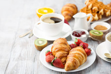 Continental Breakfast Table With Coffee, Orange Juice, Croissants