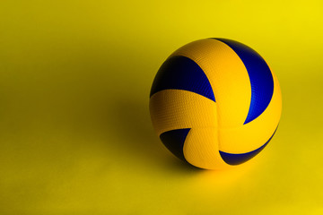 Wall Mural - volleyball ball on yellow background.