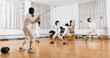 © JackF - adults and children athletes at fencing workout