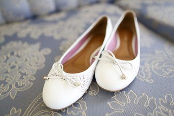 Wall Mural - Bride's white flat wedding shoes