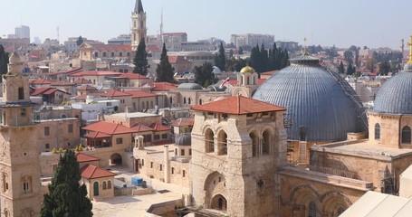 Wall Mural - Christian priest comes out of the interior of the Temple of the Holy Sepulcher in Jerusalem, Israel