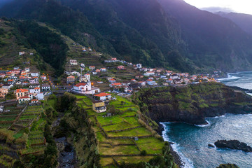 Fototapete - Beautiful mountain village on Madeira island, Portugal, at sunset. Aerial view.
