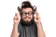© DenisNata - Crazy Bearded happy Man with funny Haircut in Eyeglasses making Luck gesture. Cheerful and silly guy crossing his fingers, isolated on white background.
