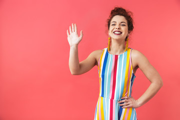 Canvas Print - Portrait of a cheerful young woman wearing dress