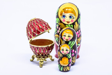 Matryoshka family. Matrioska art Russian doll and Russian souvenir, egg casket copy of Faberge on a White background