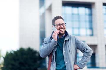 Receiving good news.Businessman talking on the smartphone