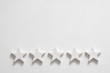 Customer experience. Service rating and review. Assessment survey. Five star shapes. Copy space on white background.
