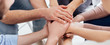 © LIGHTFIELD STUDIOS - panoramic shot of people stacking hands during group therapy session