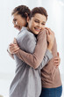 © LIGHTFIELD STUDIOS - beautiful happy women embracing during therapy meeting