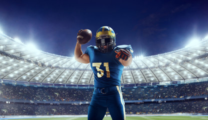 Wall Mural - American football player in professional sport arena.